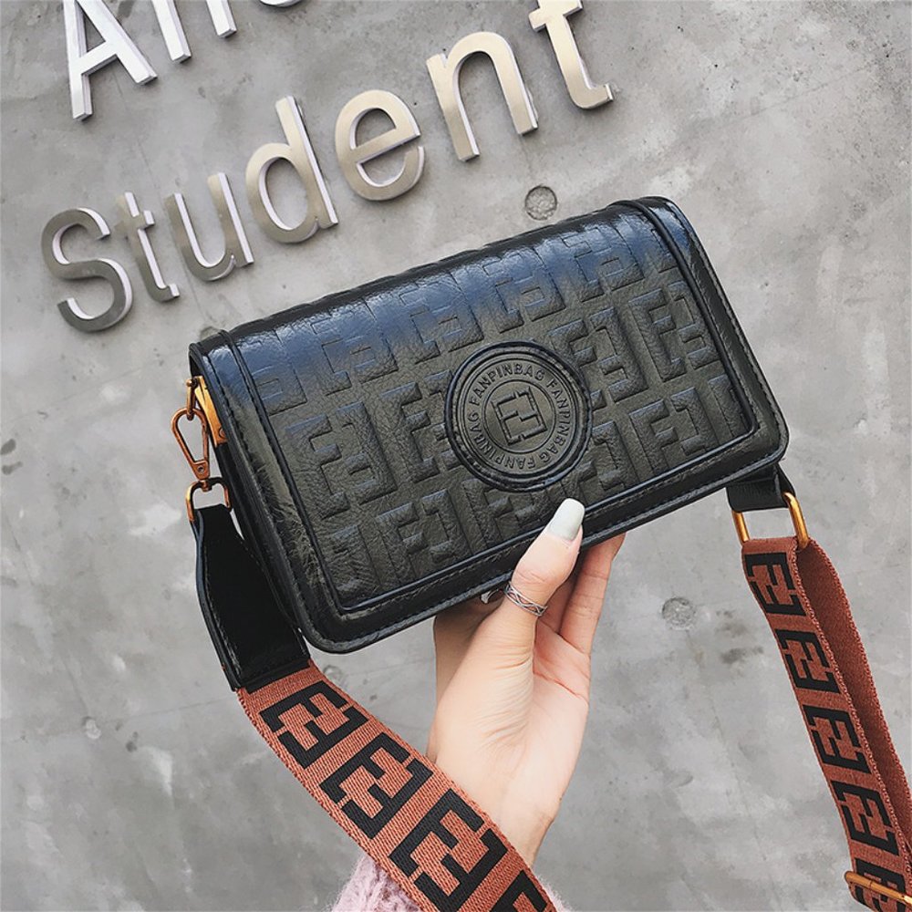 Embossed Black faux leather bag Designer details  Bag can be converted into clut